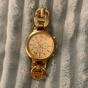 Gold Watch Quartz  Japan Mvnt. Bangle slip on gold band. Stainless Steel back